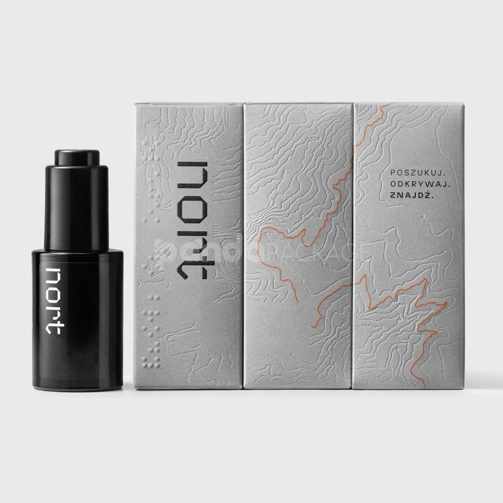 luxury textured grey paperboard box for skincare packaging with embossed terrain pattern and orange foil line details