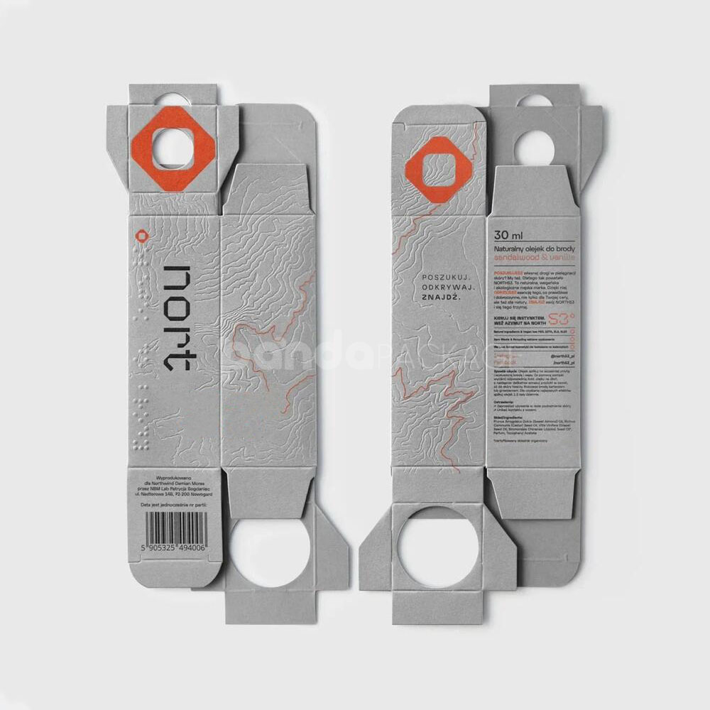 luxury textured grey paperboard box for skincare packaging with embossed terrain pattern and orange foil line details