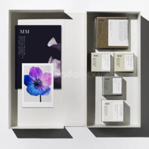 sustainable minimalist cosmetic packaging box made from recyclable paperboard with embossed typography and natural color finish