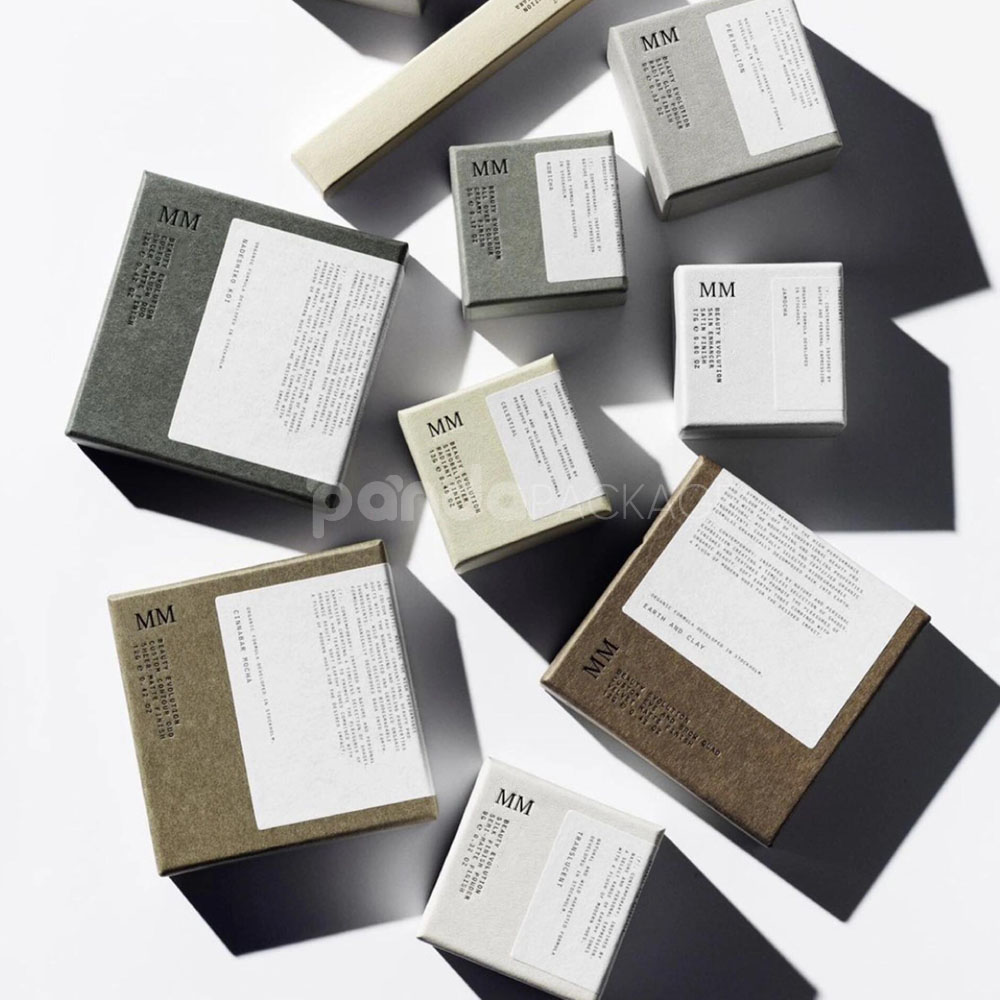 sustainable minimalist cosmetic packaging box made from recyclable paperboard with embossed typography and natural color finish