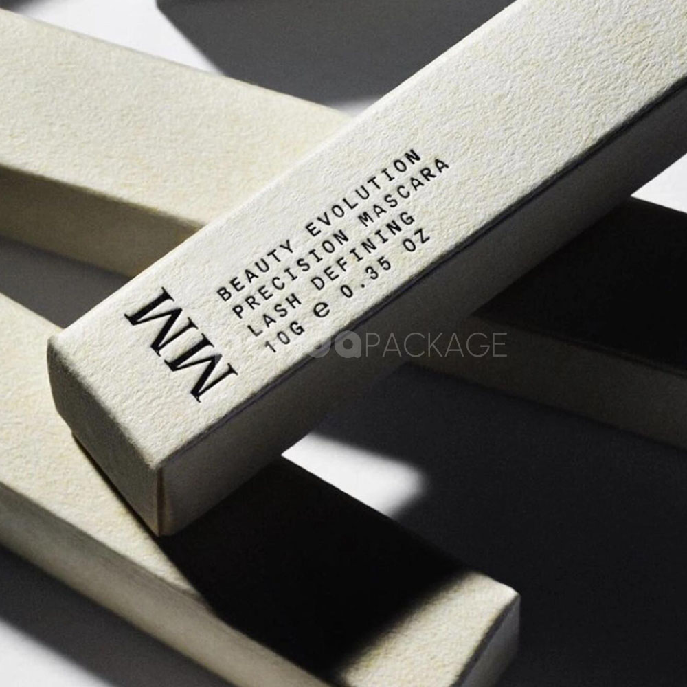 sustainable minimalist cosmetic packaging box made from recyclable paperboard with embossed typography and natural color finish