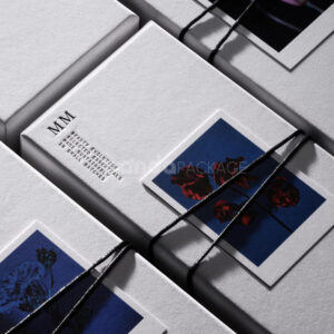 sustainable minimalist cosmetic packaging box made from recyclable paperboard with embossed typography and natural color finish