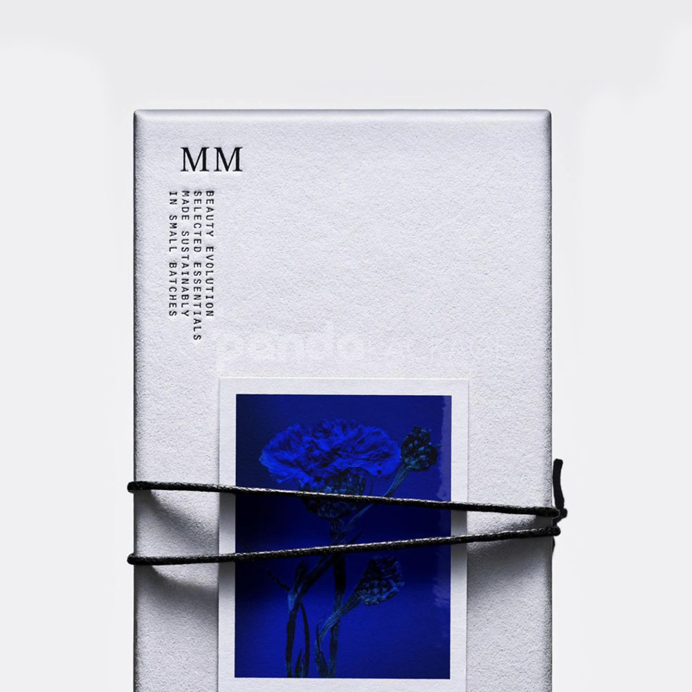 sustainable minimalist cosmetic packaging box made from recyclable paperboard with embossed typography and natural color finish