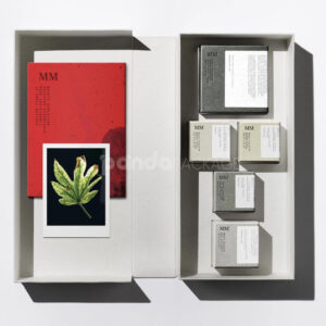 sustainable minimalist cosmetic packaging box made from recyclable paperboard with embossed typography and natural color finish