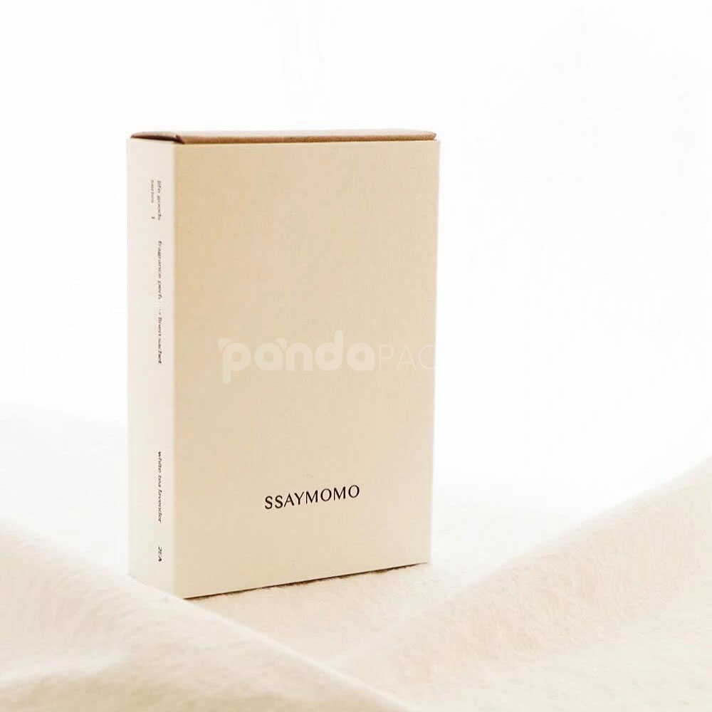 eco-friendly paperboard drawer box with minimalist design and kraft inner tray for skincare and fragrance packaging