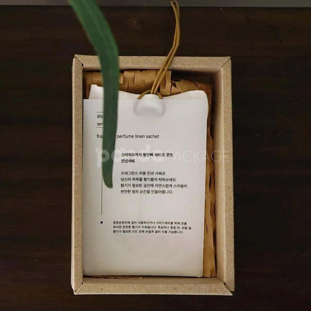 eco-friendly paperboard drawer box with minimalist design and kraft inner tray for skincare and fragrance packaging