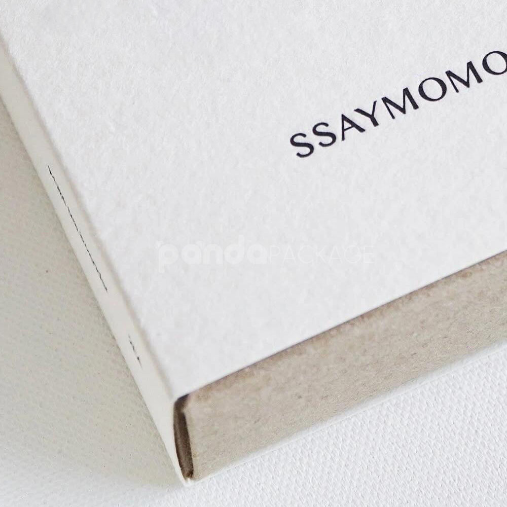 eco-friendly paperboard drawer box with minimalist design and kraft inner tray for skincare and fragrance packaging