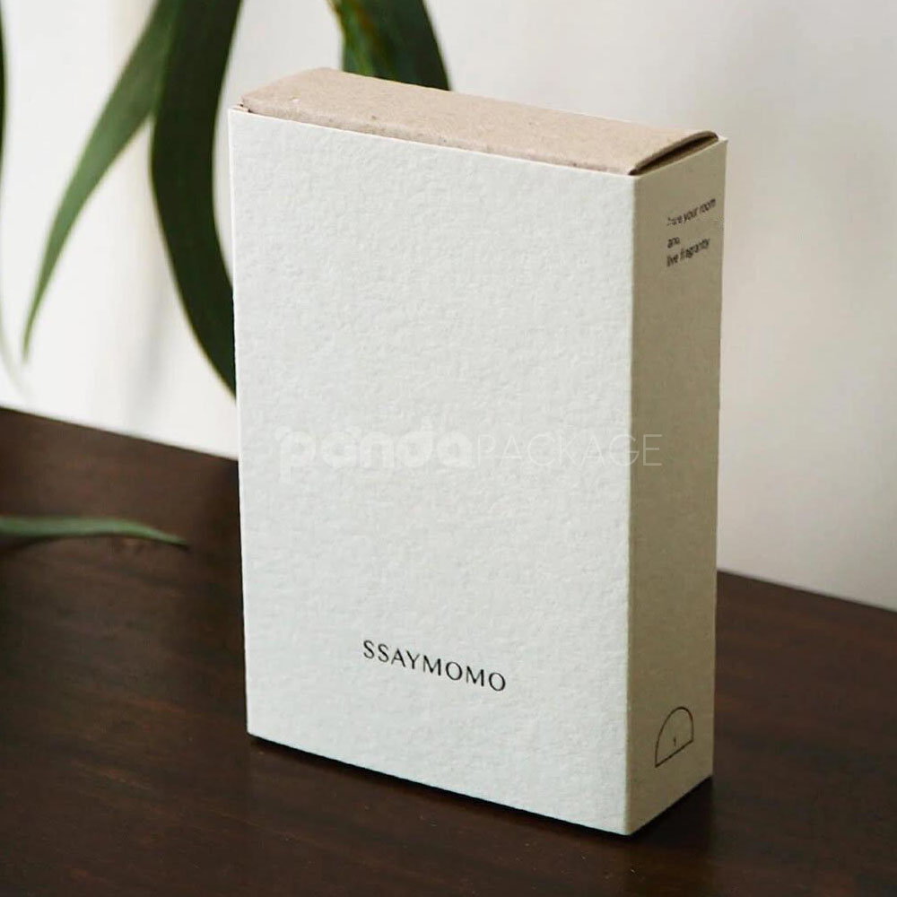 eco-friendly paperboard drawer box with minimalist design and kraft inner tray for skincare and fragrance packaging