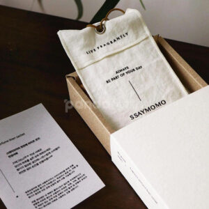 eco-friendly paperboard drawer box with minimalist design and kraft inner tray for skincare and fragrance packaging