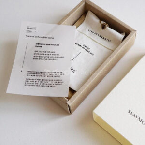 eco-friendly paperboard drawer box with minimalist design and kraft inner tray for skincare and fragrance packaging