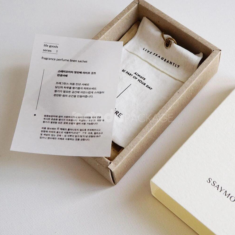 eco-friendly paperboard drawer box with minimalist design and kraft inner tray for skincare and fragrance packaging