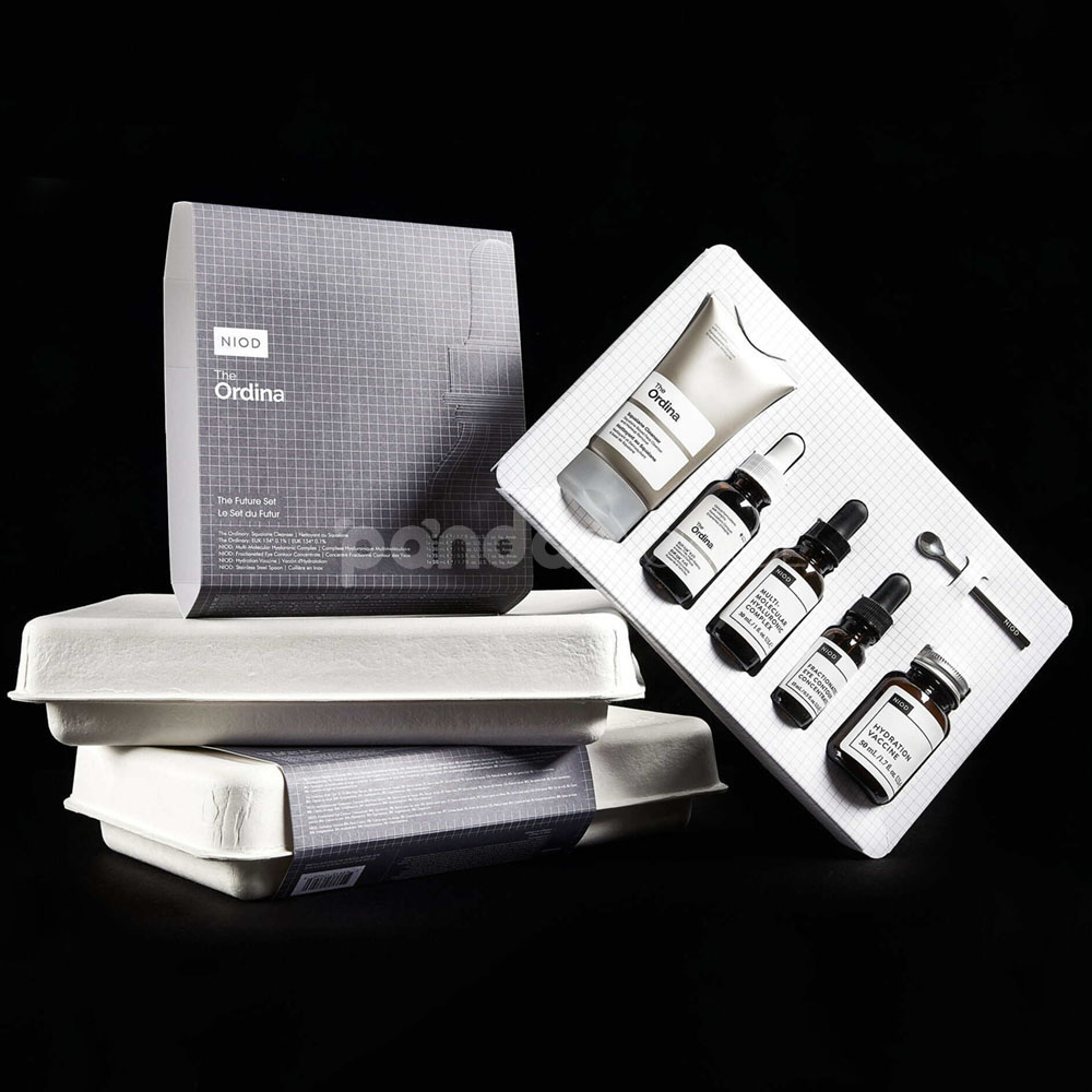 biodegradable white molded pulp skincare box with hinged lid and custom insert for sustainable cosmetic packaging