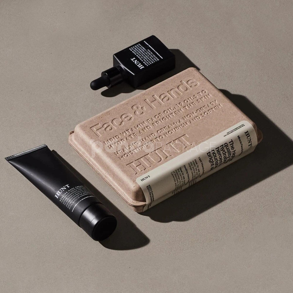 biodegradable molded pulp cosmetic box with embossed typography and printed sleeve for sustainable body care packaging