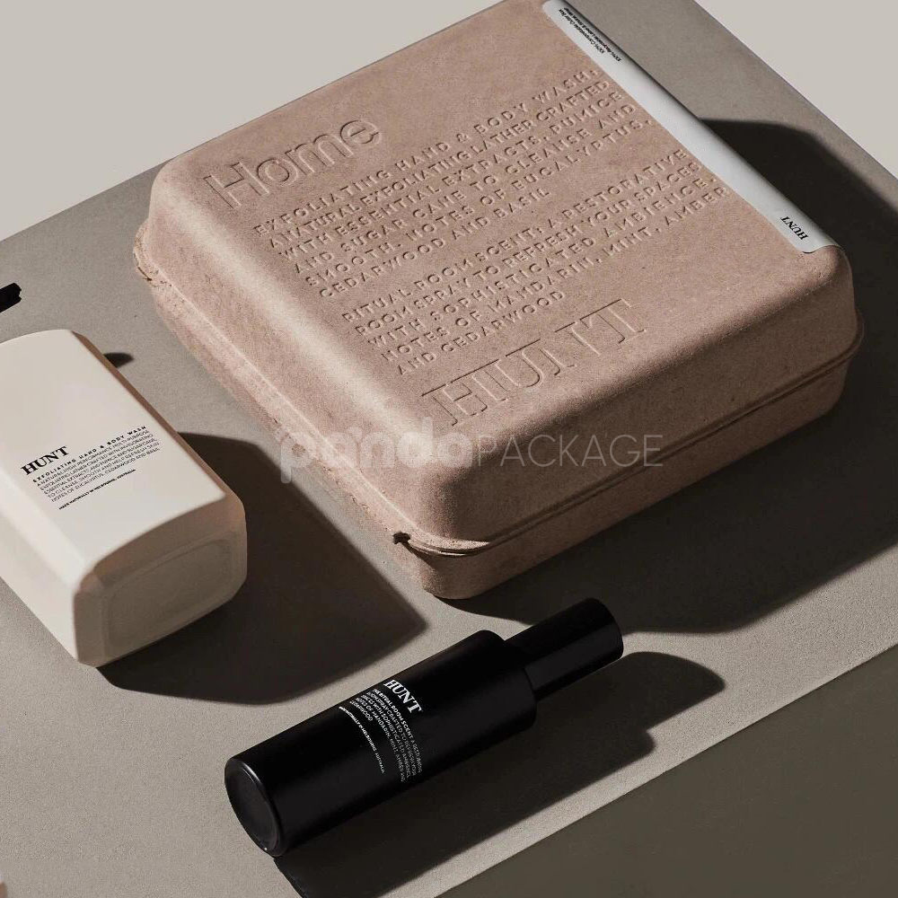biodegradable molded pulp cosmetic box with embossed typography and printed sleeve for sustainable body care packaging
