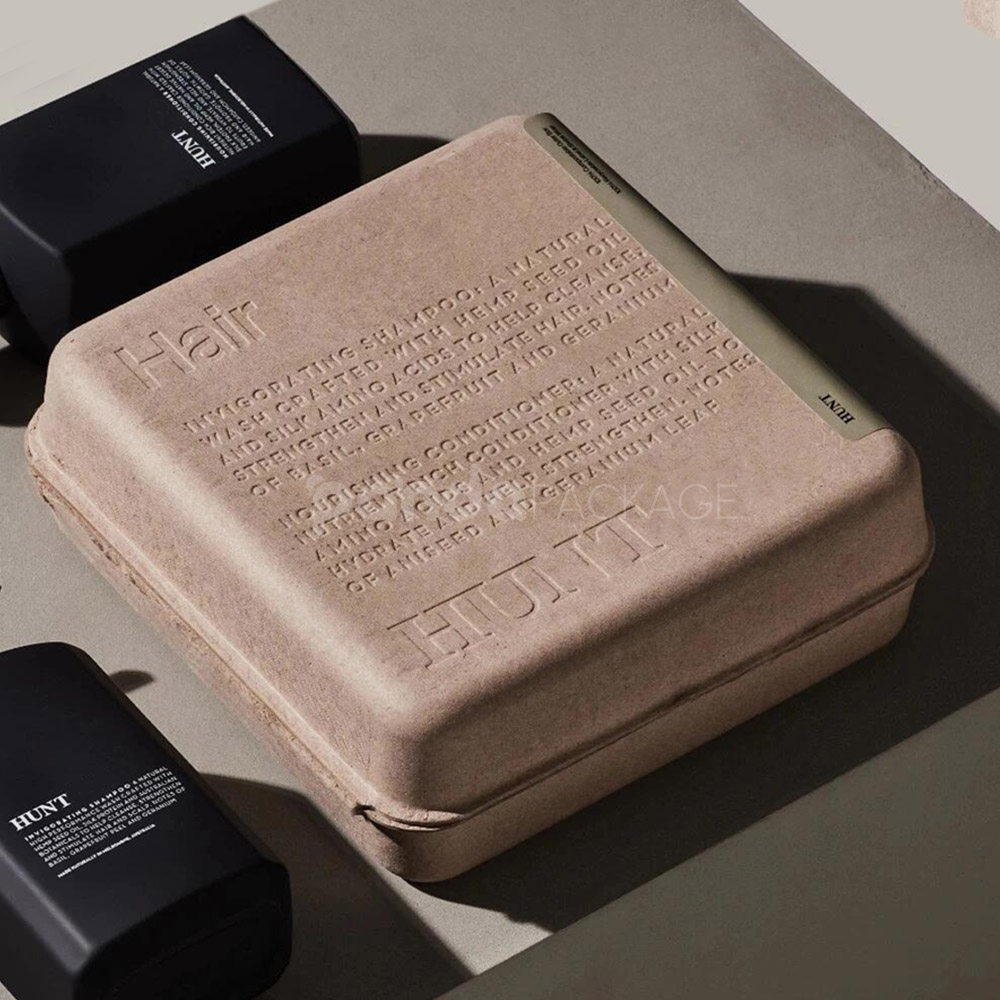 biodegradable molded pulp cosmetic box with embossed typography and printed sleeve for sustainable body care packaging