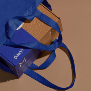 two-tone corrugated cardboard mailer box with easy-open tear strip for electronics packaging