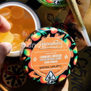 round metal tin box for cannabis infused gummies and edibles packaging with colorful printed lid design
