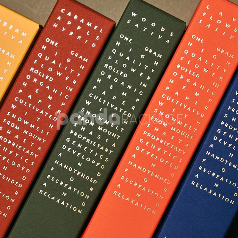 premium matte paperboard box for cannabis pre-roll packaging with gold foil stamping and minimal design