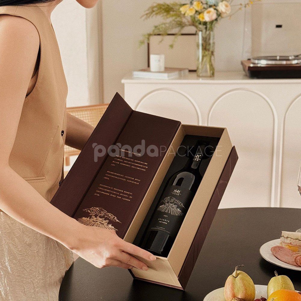 luxury burgundy rigid magnetic wine packaging box with gold foil logo and matching paper bag for single-bottle presentation
