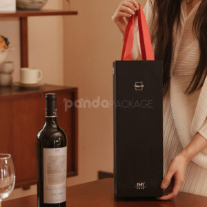luxury black rigid magnetic wine packaging box with silver foil logo and matching paper bag for single-bottle presentation