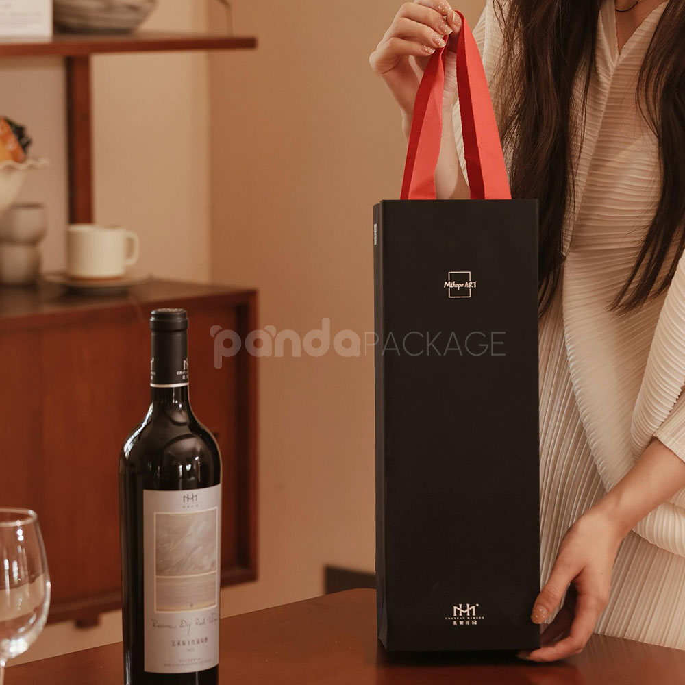 luxury black rigid magnetic wine packaging box with silver foil logo and matching paper bag for single-bottle presentation