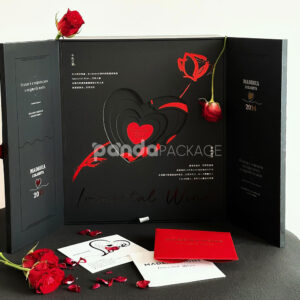 luxury black double-door rigid wine packaging box with heart embossed pattern and red interior for two-bottle gift presentation