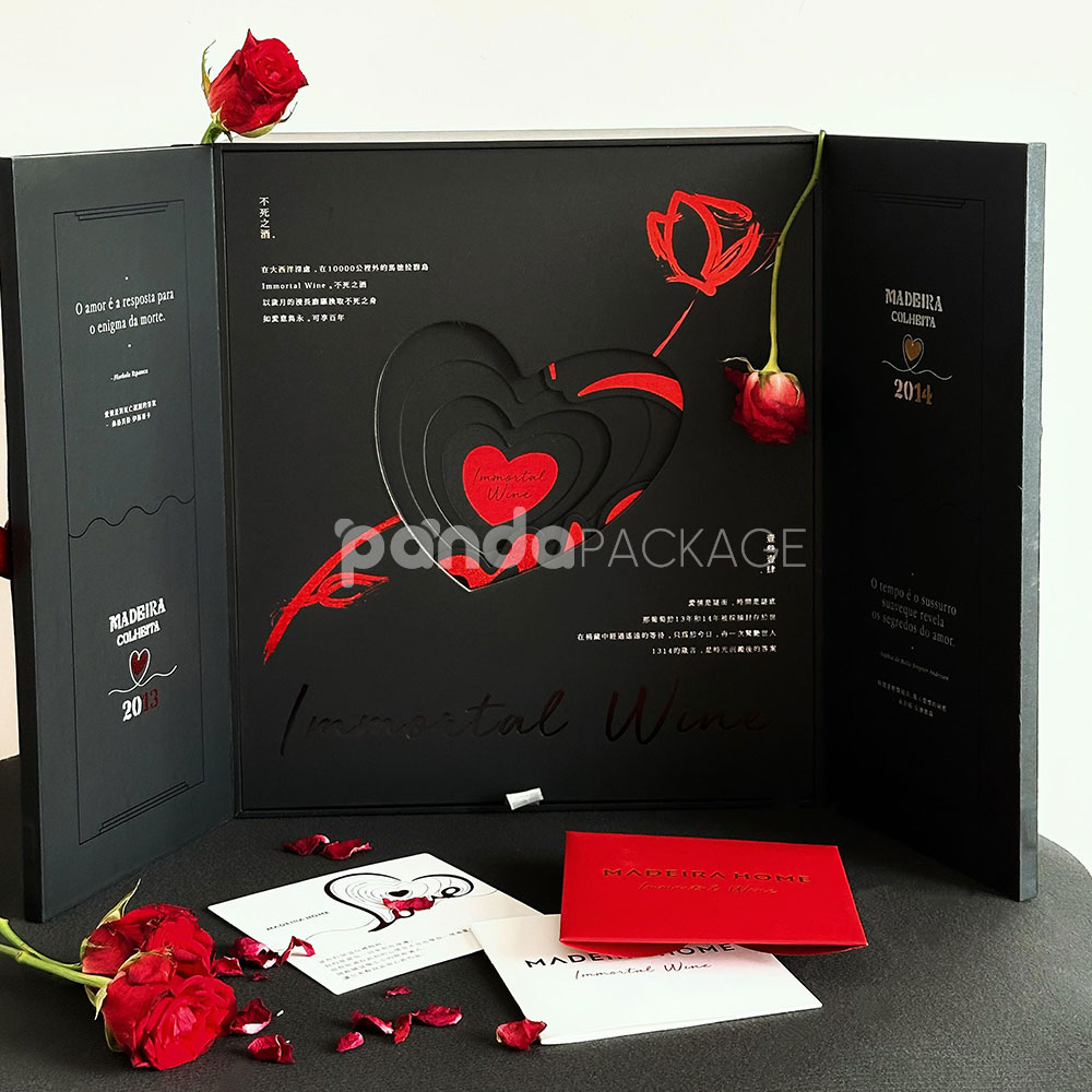 luxury black double-door rigid wine packaging box with heart embossed pattern and red interior for two-bottle gift presentation