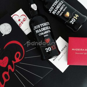 luxury black double-door rigid wine packaging box with heart embossed pattern and red interior for two-bottle gift presentation