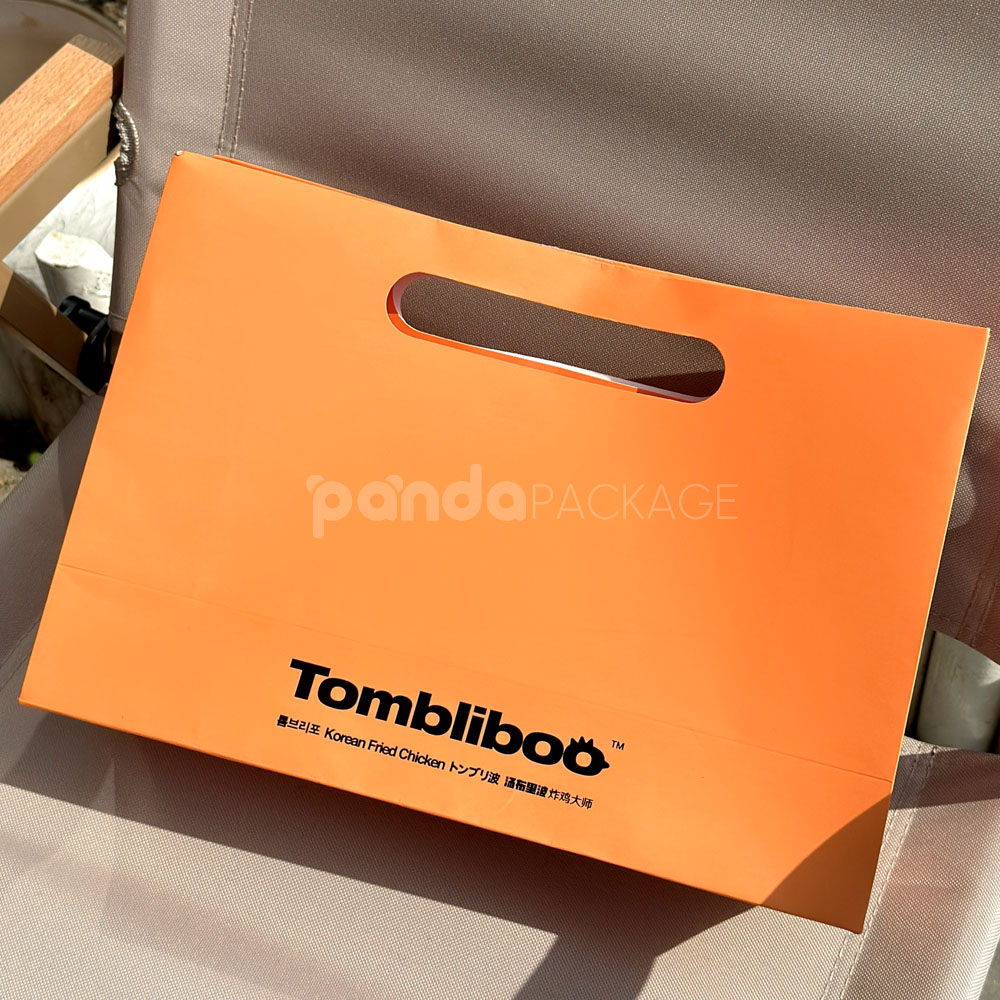 orange paper carry bag with die-cut handle for food packaging