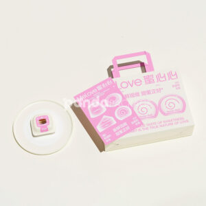 pink and white paperboard donut box with gable handle for bakery and cake packaging