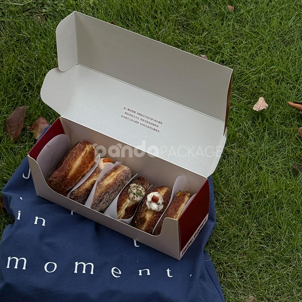 red and pale yellow paperboard donut box with tuck top lid for bakery takeout and gift packaging