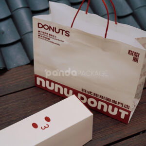 red and pale yellow paperboard donut box with tuck top lid for bakery takeout and gift packaging