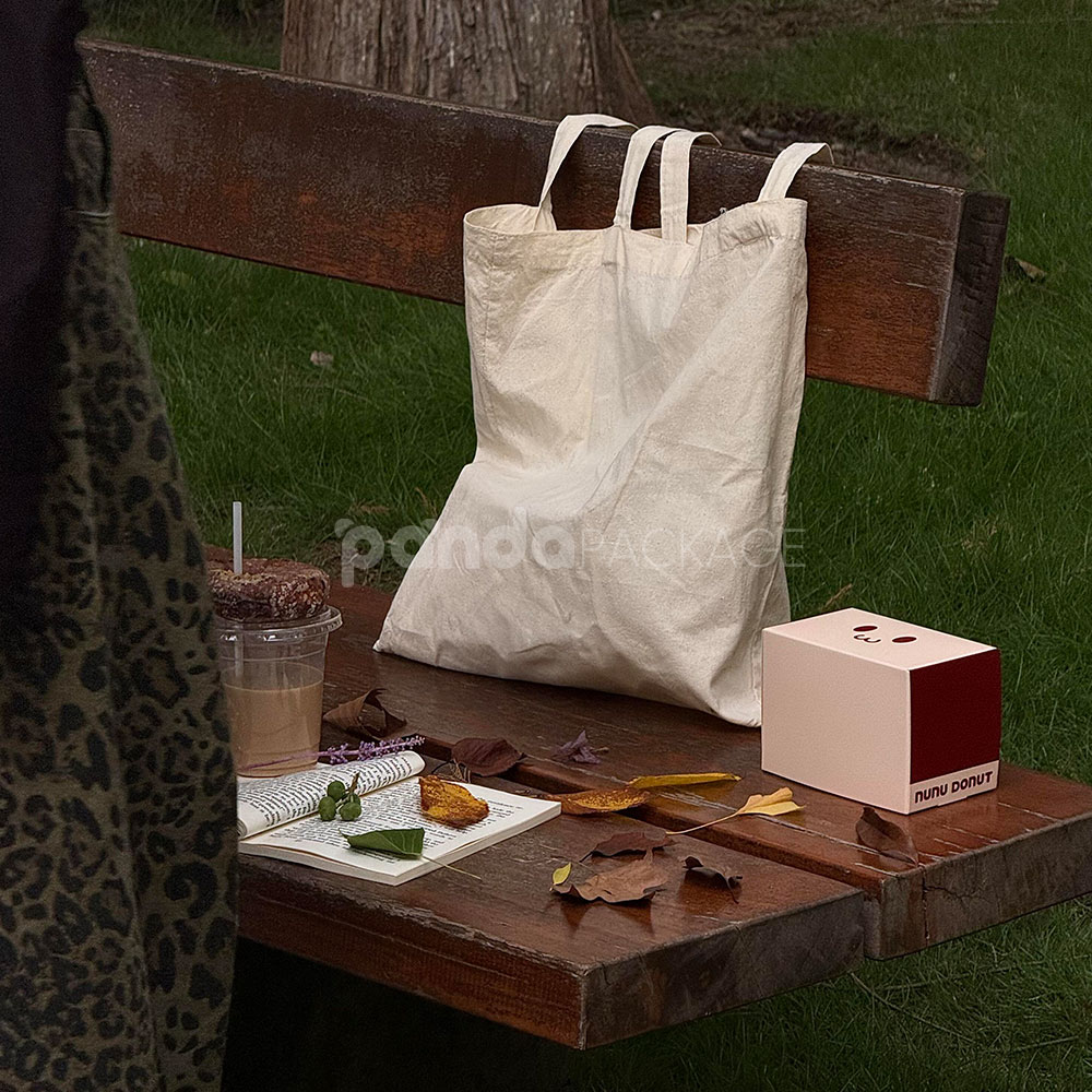 red and pale yellow paperboard donut box with tuck top lid for bakery takeout and gift packaging