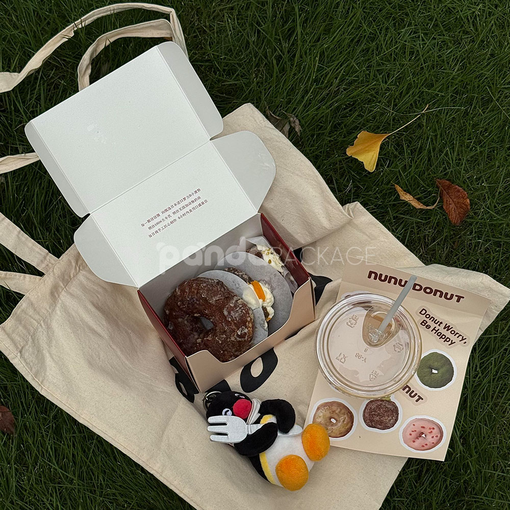 red and pale yellow paperboard donut box with tuck top lid for bakery takeout and gift packaging