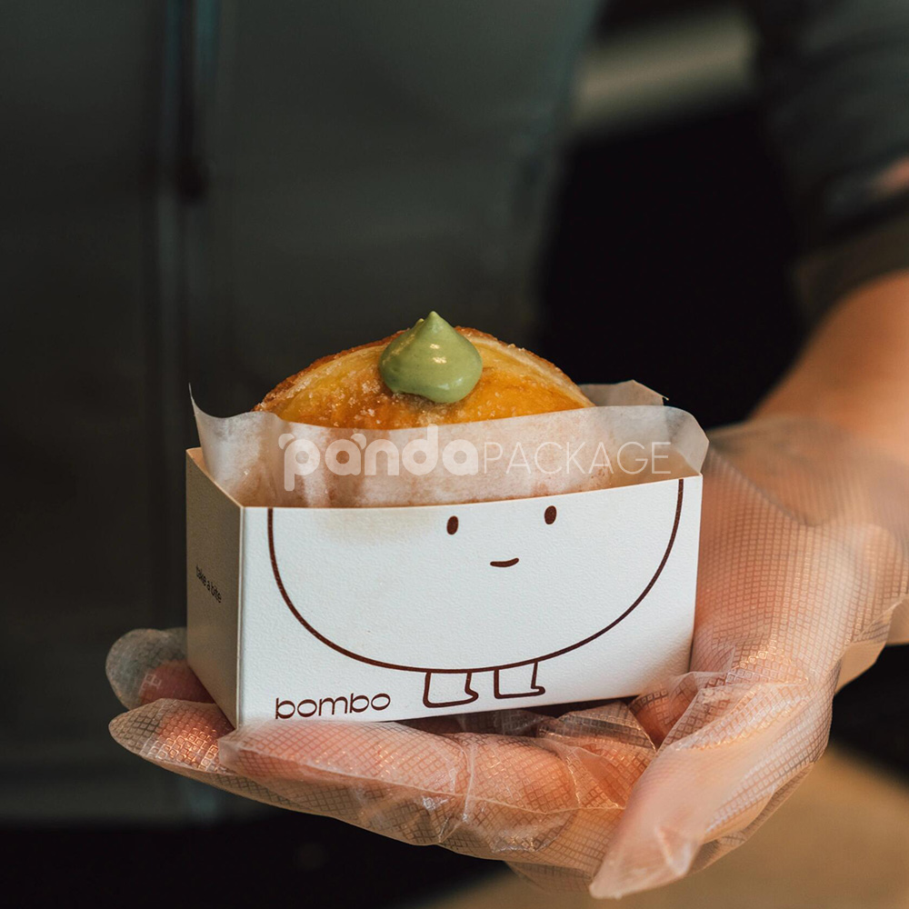 white paperboard donut tray with cute cartoon character design for bakery takeout and dessert packaging