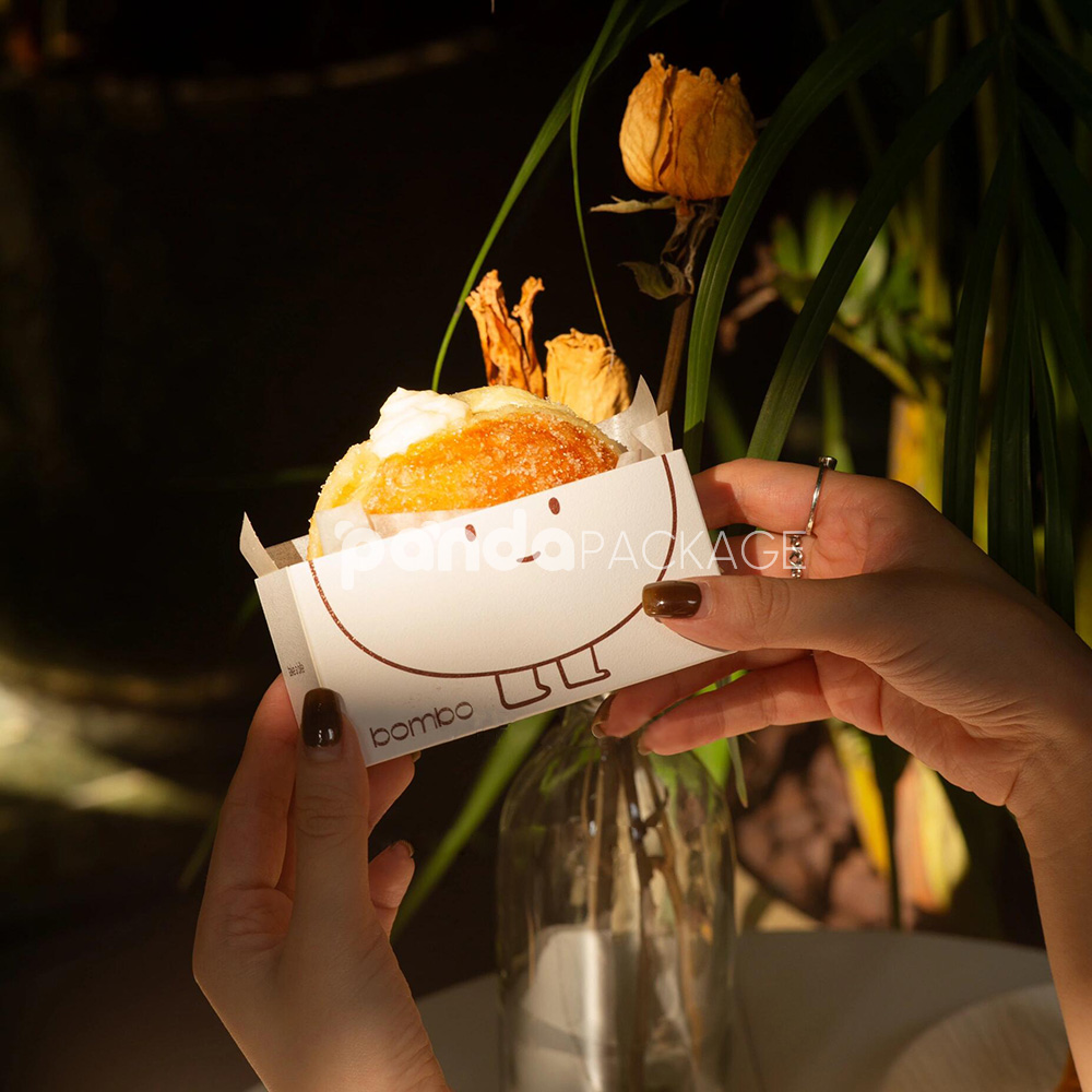 white paperboard donut tray with cute cartoon character design for bakery takeout and dessert packaging