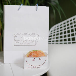 white paperboard donut tray with cute cartoon character design for bakery takeout and dessert packaging