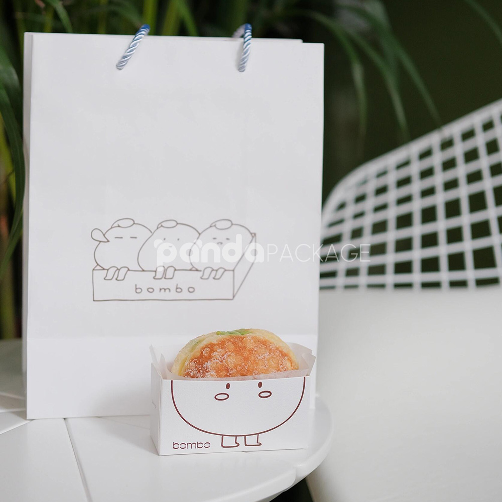 white paperboard donut tray with cute cartoon character design for bakery takeout and dessert packaging