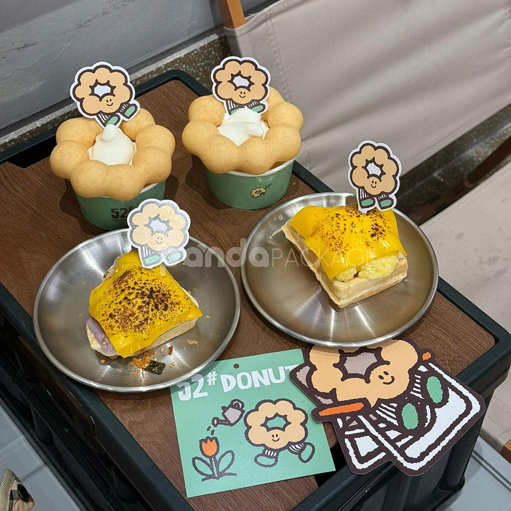 mint green paper donut cup with printed cafe logo design for bakery and dessert packaging