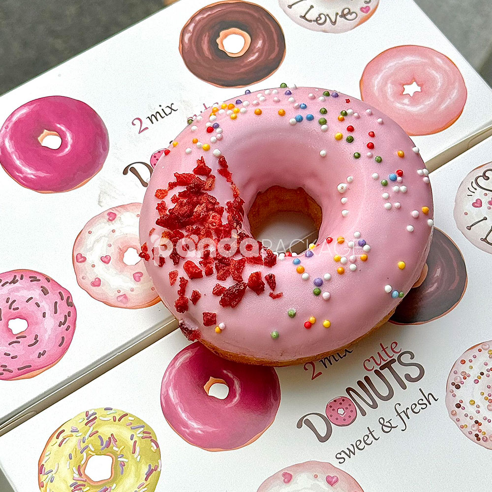 white paperboard donut box with colorful illustrated design for bakery gift and dessert packaging