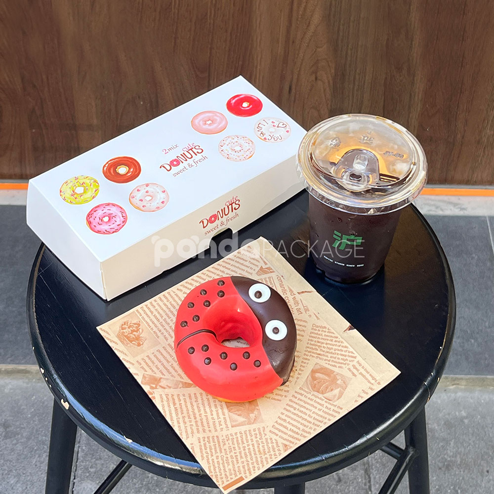 white paperboard donut box with colorful illustrated design for bakery gift and dessert packaging