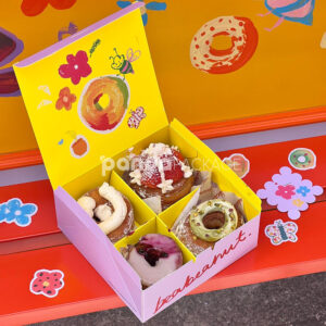 colorful paperboard donut gift box with hand-painted illustration and yellow interior for bakery and dessert packaging