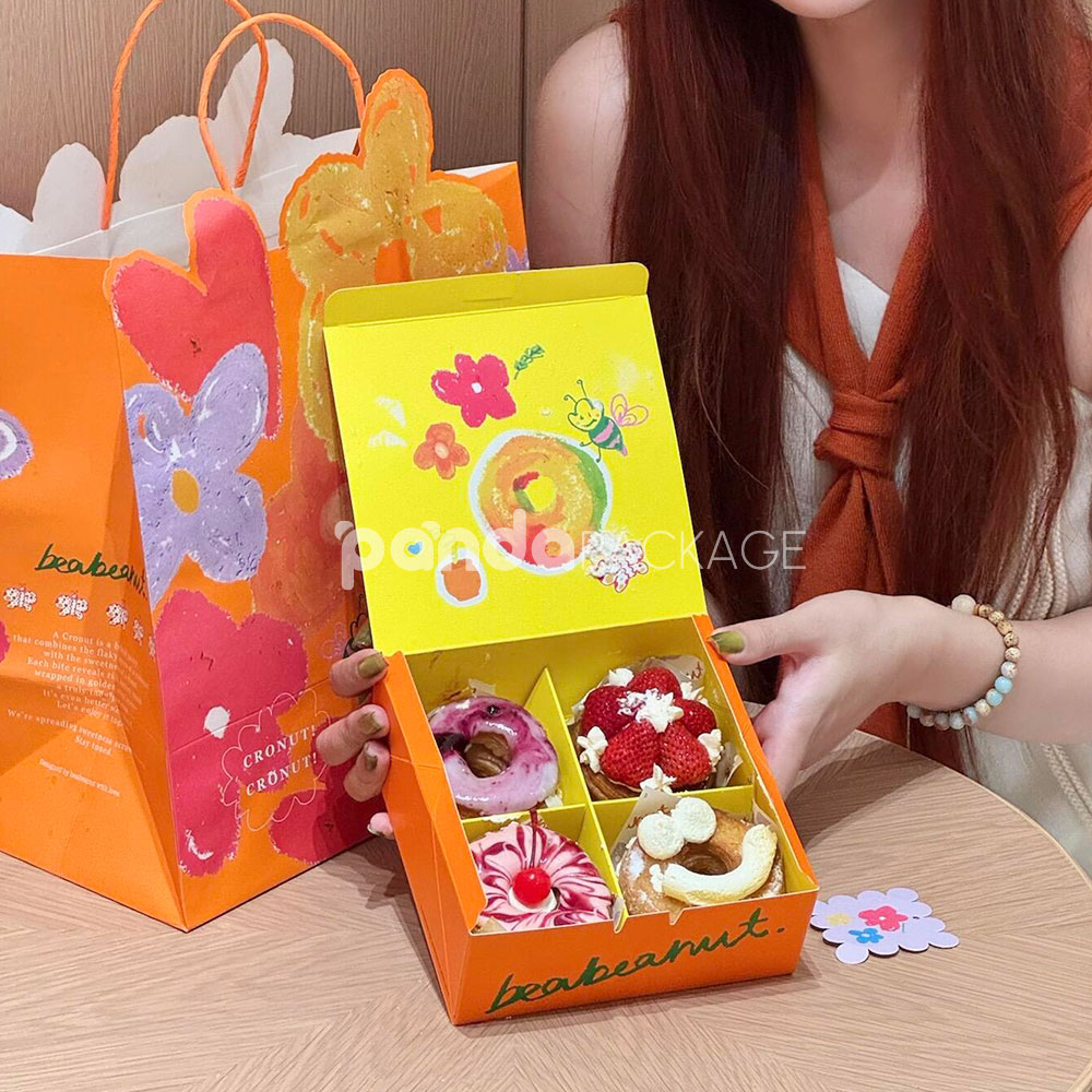 colorful paperboard donut gift box and bag with hand-painted illustration and yellow interior for bakery and dessert packaging
