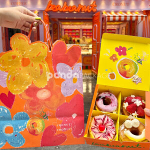 colorful paperboard donut gift box and bag with hand-painted illustration and yellow interior for bakery and dessert packaging