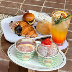 blue and yellow checkered paper donut cup with cute cartoon logo for bakery and cafe dessert packaging