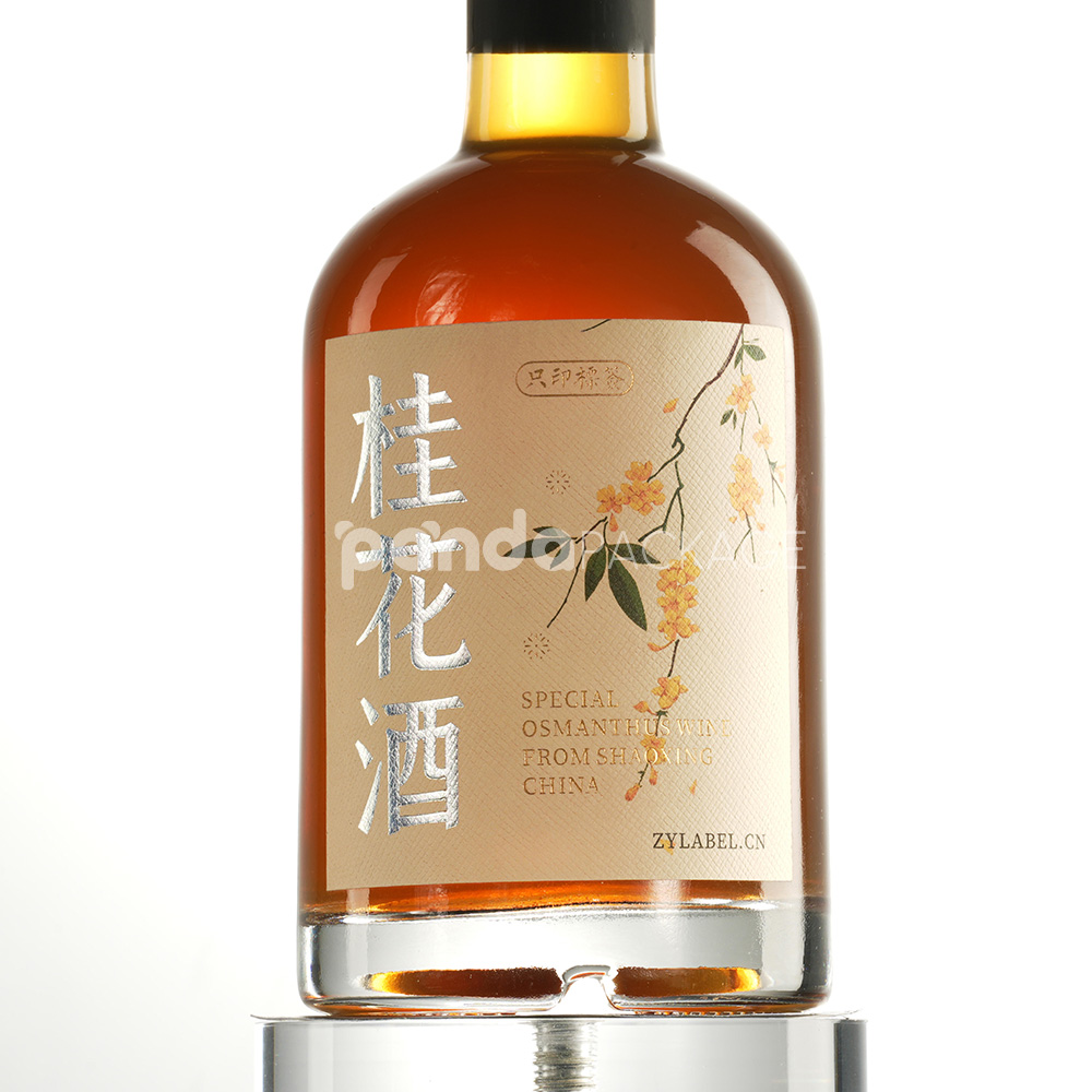 textured wine bottle labels with silver foil and floral design