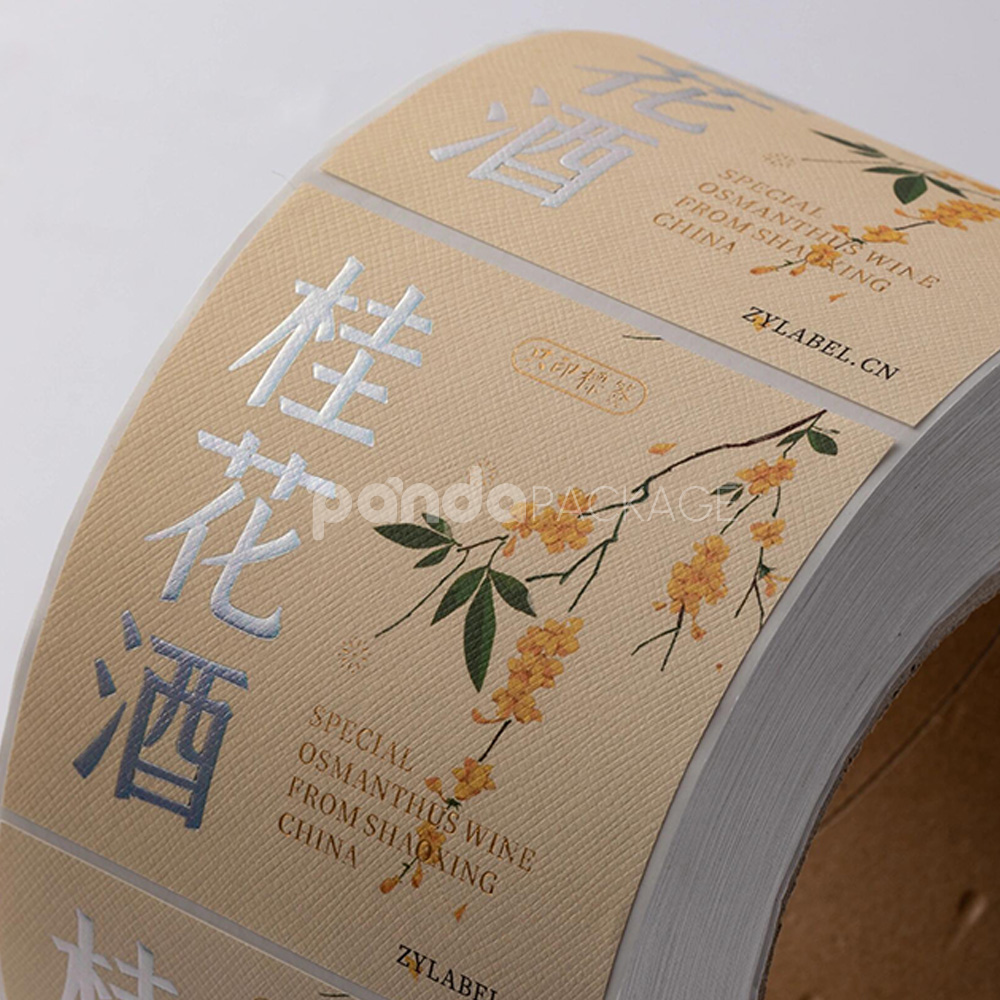 textured wine bottle labels with silver foil and floral design